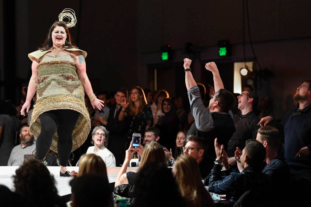 Fans of Jesse Riesenberger give her an enthusiastic cheer as she models Jessica Sullivans Calm in the Wild at the Wearable Art show at Centennial Hall on Saturday, Feb. 16, 2019. (Michael Penn | Capital City Weekly)