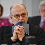Sen. Click Bishop, R-Fairbanks, rests his head on a Constitution of Alaska booklet as he listens to Donna Arduin, Director of the Office of Management and Budget, and Mike Barnhill, policy director for the OMB, continue to present Gov. Mike Dunleavys budget to the Senate Finance Committee at the Capitol on Tuesday, Feb. 18, 2019. Senate President Cathy Giessel, R - Anchorage, left, and Sen. Gary Stevens, R-Kodiak, right, are in the background. (Michael Penn | Juneau Empire)
