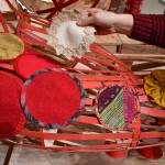 Jackie Manning, curator of exhibitions at the Alaska State Museum show how an octopus model, built by exhibits specialist Aaron Elmore, will be covered in fabric patches before installation in the Discovery Room in early April. (Michael Penn | Juneau Empire)