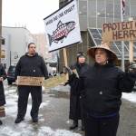 Nancy Keen, right, Vivian Mork, Marvin Willard and Rosita Worl, left, hold a protest outside the Dimond Courthouse as a court hearing between the Sitka Tribe of Alaska and the Department of Fish and Game on herring limits in Sitka Sound takes place inside on Tuesday, Feb. 18, 2019. (Michael Penn | Juneau Empire)