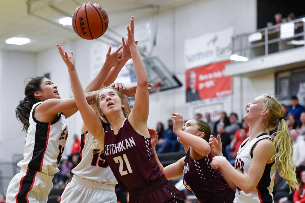 Ketchikans Ashley Huffine keeps her eye on the ball for a rebound against Juneau-Douglas at JDHS on Friday, Feb. 22, 2019. JDHS won 56-38. (Michael Penn | Juneau Empire)