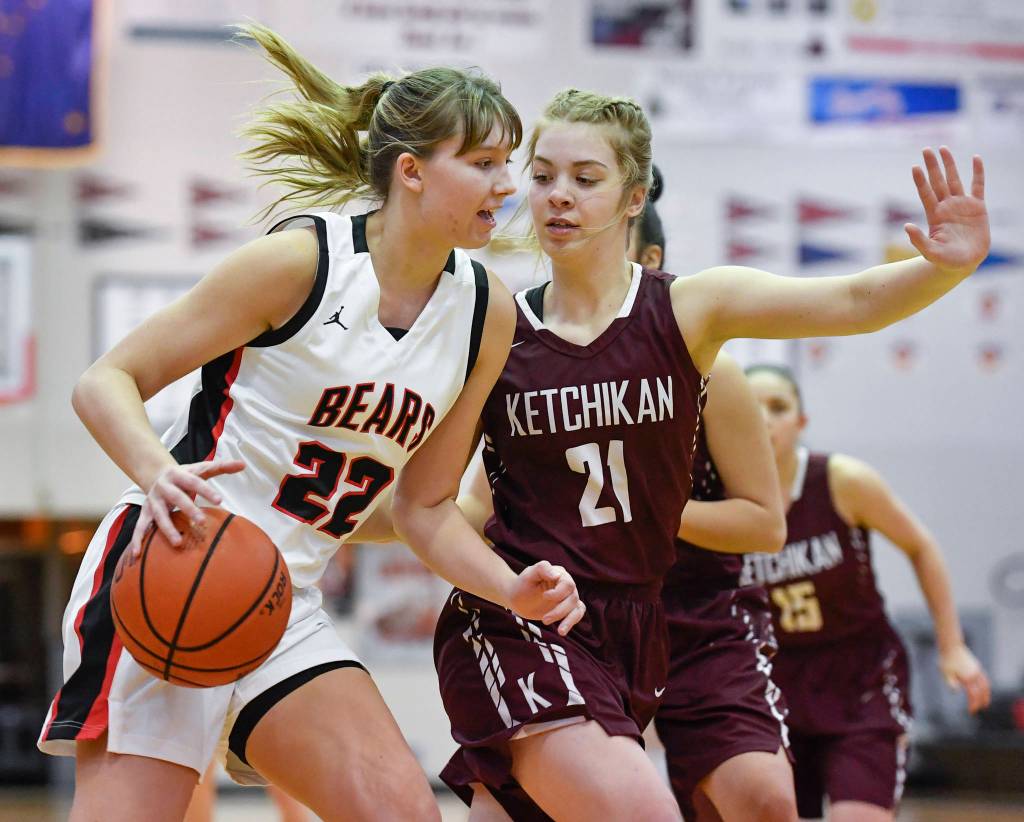 Juneau-Douglas Caitlin Pusich, left, drives against Ketchikans Ashley Huffine at JDHS on Friday, Feb. 22, 2019. JDHS won 56-38. (Michael Penn | Juneau Empire)