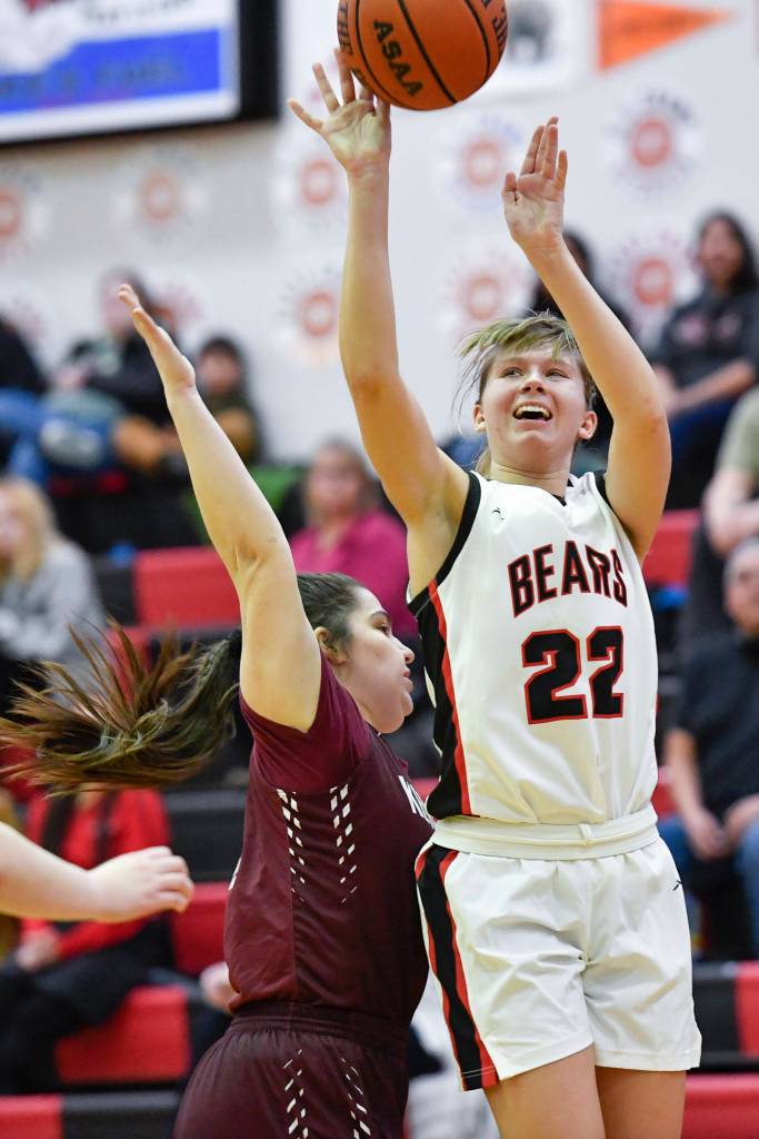 Juneau-Douglas Caitlin Pusich, right, shoots against Ketchikans Nadire Zhuta at JDHS on Friday, Feb. 22, 2019. JDHS won 56-38. (Michael Penn | Juneau Empire)