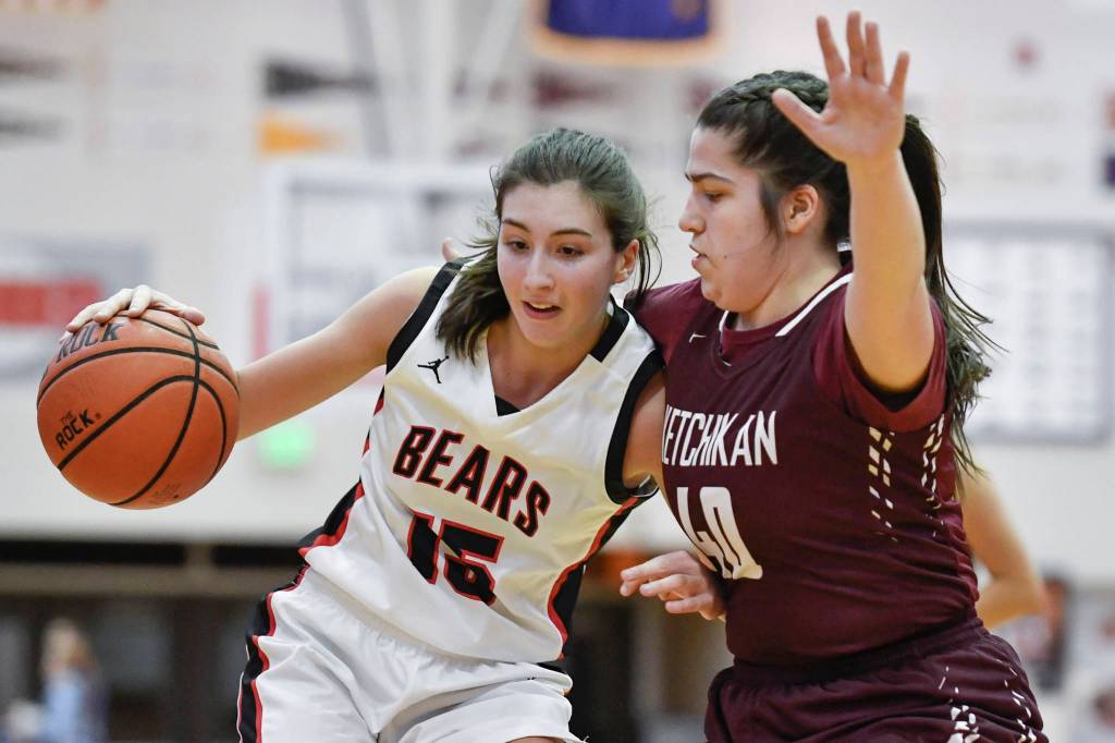 Juneau-Douglas Jenae Pusich, left, drives against Ketchikans Nadire Zhuta at JDHS on Friday, Feb. 22, 2019. JDHS won 56-38. (Michael Penn | Juneau Empire)