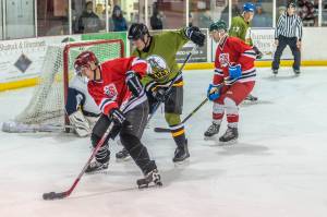 Hockey game pits capitals against one another