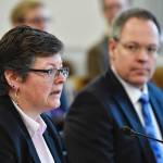 Michelle Prebula, an investment officer with the Department of Revenue, left, and Bruce Tangeman, Commissioner of Revenue, give a presentation on the states cash flow in front of the Senate Finance Committee on Thursday, Feb. 28, 2019. (Michael Penn | Juneau Empire)
