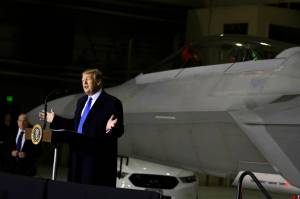 President Donald Trump speaks to service members at Joint Base Elmendorf-Richardson, Thursday, Feb. 28, 2019, in Anchorage, Alaska., during a refueling stop as he returns from Hanoi. (AP Photo/Evan Vucci)
