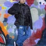 March 10, 2019: I met 11-year-old Joel Price one evening at The Pipeline skate park. Joel has a great attitude and demonstrates that a single piece of clothing can define a certain look. His faux black leather jacket with silver studs was the definite focal point of his outfit. Add in a black felt fedora, black T-shirt, Hollister button-fly jeans and canvas tennis shoes to complete the look.