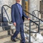 March 3, 2019: On the steps of the Capitol, Tom Atkinson, legislative staffer, cuts a fine form in his slim-cut wool suit from Trend Maxman. His suit coordinates impeccably with his cotton paisley shirt by Nordstrom, Italian silk neck tie from Andrews Ties and Brunomagli shoes, also made it Italy. (Kerry Howard | For the Juneau Empire)