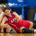 Klawocks Kenai Holien, left, dives for the ball against Kakes Courtney James in the finals of the Region V 1A Basketball Championships at Thunder Mountain High School on Friday, March 1, 2019. Klawock won 47-46. (Michael Penn | Juneau Empire)