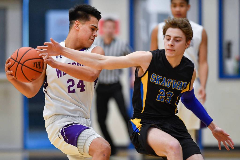 Skagways Gavin Goebel, right, attempts a steal against Hydaburgs Guy Sanderson at the Region V 1A Basketball Championships at Thunder Mountain High School on Wednesday, Feb. 27, 2019. Hydaburg won 43-35. (Michael Penn | Juneau Empire)