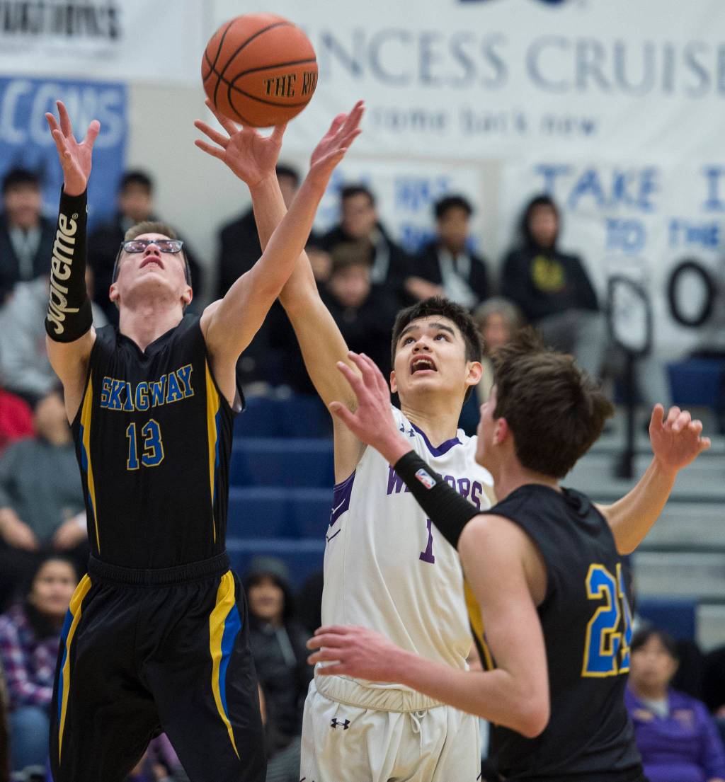Skagways Wyatt Belisle, left, and Hydaburgs Willis Washington battle for a rebound at the Region V 1A Basketball Championships at Thunder Mountain High School on Wednesday, Feb. 27, 2019. Hydaburg won 43-35. (Michael Penn | Juneau Empire)