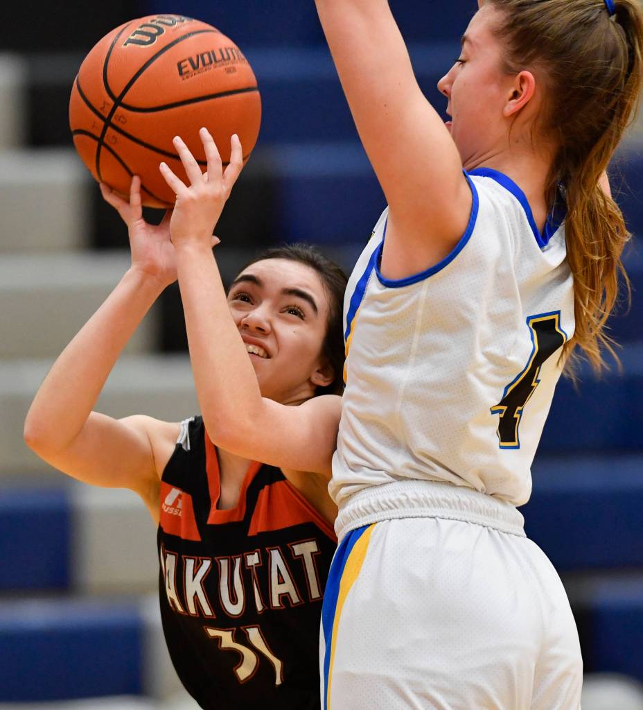 Yakutats Giuliana Hoadley, left, has her shot blocked by Skagways Faith Wagner at the Region V 1A Basketball Championships at Thunder Mountain High School on Wednesday, Feb. 27, 2019. (Michael Penn | Juneau Empire)