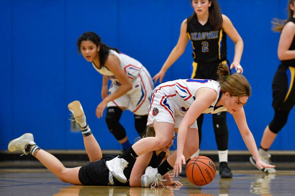 Kakes Jade Beer, keeps the ball away from Skagways Tatum Sager at the Region V 1A Basketball Championships at Thunder Mountain High School on Thursday, Feb. 28, 2019. Kake won 43-30. (Michael Penn | Juneau Empire)