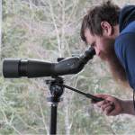 Phil Algar looks out the window at the Mendenhall Valley Glacier Visitor Center, Saturday, March 2, 2019. Algar, who was visiting from White Horse was surprised by the crowd at the center Saturday for an open house. (Ben Hohenstatt | Juneau Empire)