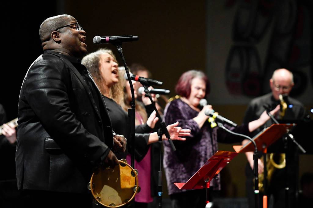 Bobby Lewis, left, and Jaunelle Celaire sing during the performance of Motown for Our Town at the Juneau Arts & Culture Center on Friday, March 1, 2019. (Michael Penn | Juneau Empire)
