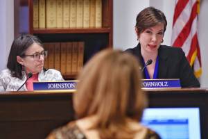 Chair Rep. Jennifer Johnston, R-Anchorage, left, listens as Rep. Ivy Spohnholz, D-Anchorage, asks a question of Sana Efird, Administrative Services Director for the Office of Management and Budget, as Efird gives a budget overview presentation of the Alaska Pioneer Homes during a House Finance Subcommittee at the Capitol on Tuesday, March 5, 2019. (Michael Penn | Juneau Empire)