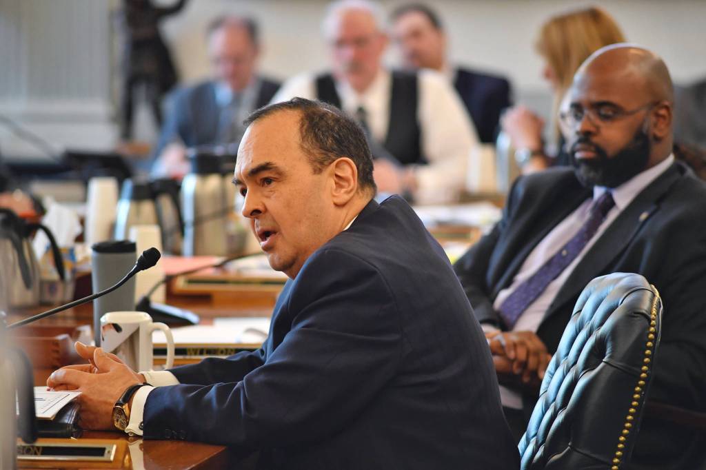 Sen. Donald Olson, D-Golovin, asks Mouhcine Guettabi, Associate Professor of Economics at the Institute of Social and Economic Research at the University of Alaska Anchorage, if Gov. Mike Dunleavys budget proposal will throw Alaska into a depression as Guettabi make his presentation to the Senate Finance Committee at the Capitol on Thursday, March 7, 2019. (Michael Penn | Juneau Empire)