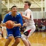 Thunder Mountains Meki Toutaiolepo prepares to shoot over Juneau-Douglas Brock McCormick in the Region V Basketball Tournament at B.J. McGillis Gymnasium in Sitka on Thursday, March 7, 2019. (Nolin Ainsworth | Juneau Empire)