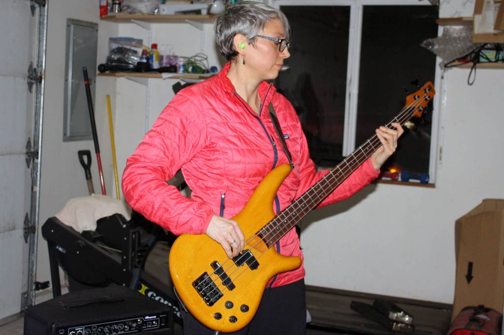 Ceann Murphy plays bass during a Fire on McGinnis practice Saturday, March 9, 2019. (Ben Hohenstatt | Capital City Weekly)