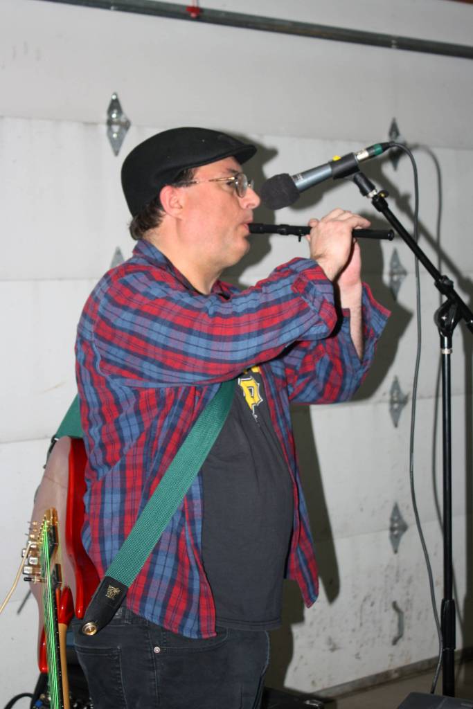 Mike Barnhill plays a modified tin whistle during a Fire on McGinnis practice Saturday, March 9, 2019. (Ben Hohenstatt | Capital City Weekly)