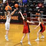 Ketchikan senior Ashley Huffine makes a shot over Juneau-Douglas sophomore Kiana Potter and junior Sadie Tuckwood during a 47-43 Kayhi victory at the Region V 4A championship match in the B.J. McGillis Gymnasium at Mt. Edgecumbe High School in Sitka. (Dustin Safranek | Ketchikan Daily News)