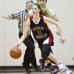 Juneau-Douglas Kendyl Carson dribbles from Palmers Lorna Suaava during the 2016 Princess Cruises Capital City Classic on Wednesday, Dec. 28, 2016. (Michael Penn | Juneau Empire File)