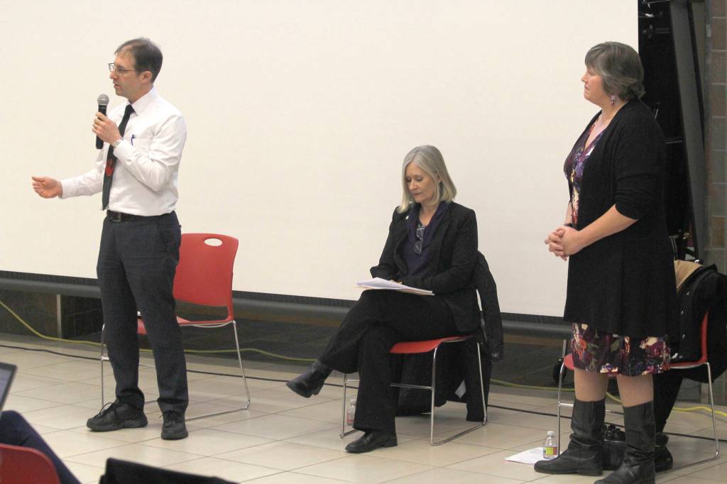 Sen. Jesse Kiehl, D-Juneau, speaks while Reps. Andi Story, center, and Sara Hannan listen at a town hall meeting on Tuesday at Juneau-Douglas High School. (Alex McCarthy | Juneau Empire)