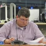 Juneau School District School Board Vice President Dan DeBartolo looks at his meeting packet during budget discussions Tuesday, March 12, 2019. (Ben Hohenstatt | Juneau Empire)