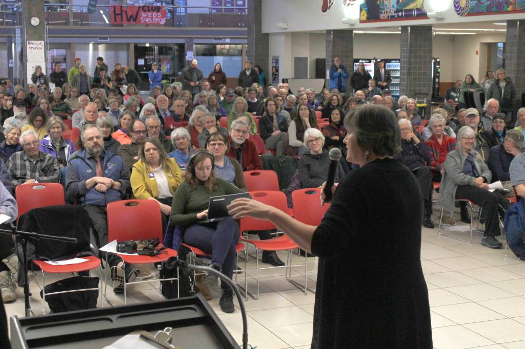 Rep. Sara Hannan, D-Juneau, speaks while a crowd listens at a town hall meeting on Tuesday at Juneau-Douglas High School. (Alex McCarthy | Juneau Empire)
