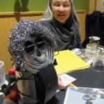 Rotarian Diane Kyser smile said she was able to create her smiley, curly-haired statue in a single morning although a load-bearing bottle of Tabasco sauce was required to keep it standing, Tuesday, March 12, 2019. (Ben Hohenstatt | Juneau Empire)