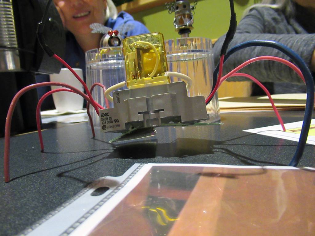 A small assemblage art spider made by Candy Behrends stands in front of other small, assemblage art pieces, Tuesday, March 12, 2019. (Ben Hohenstatt| Juneau Empire)