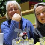 Rotarians Candy Behrends and Diane Kyser smile while talking about a planned assemblage art show and building contest near pieces of art made from household items, Tuesday, March 12, 2019. (Ben Hohenstatt | Juneau Empire)