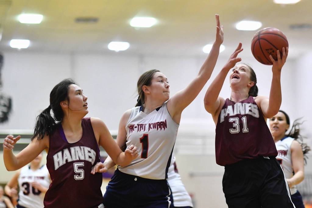 Haines Rachel Brittenham, right, shoots against Yakutat s Shaye Jensen at the Gold Medal Basketball Tournament on Friday, March 22, 2019. (Michael Penn | Juneau Empire)