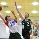 Klukwans Guy Bean, left, shoots against Haines Ryan Olsen in a B bracket game at the Juneau Lions Club 73rd Annual Gold Medal Basketball Tournament at Juneau-Douglas High School: Yadaa.at Kalé on Tuesday, March 19, 2019. Haines won 97-51. (Michael Penn | Juneau Empire)