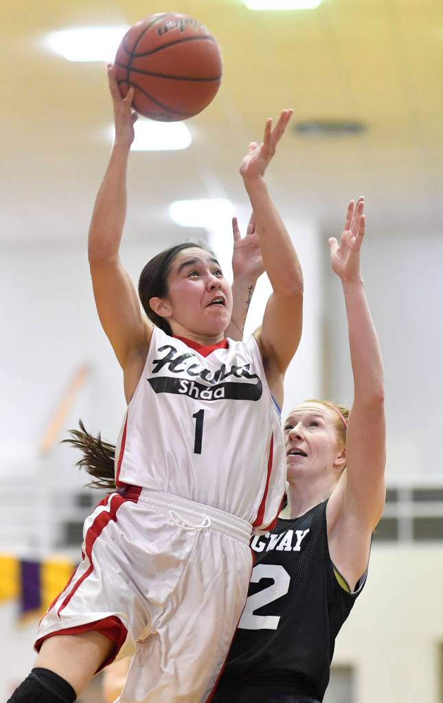 Hoonahs Melissa Fisher, left, shoots against Skagways Jesse Ellis at the Juneau Lions Club 73rd Annual Gold Medal Basketball Tournament at Juneau-Douglas High School: Yadaa.at Kalé on Tuesday, March 19, 2019. Skagway won 80-42. (Michael Penn | Juneau Empire)