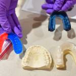 Custom mouth guards for players at the Juneau Lions Club 73rd Annual Gold Medal Basketball Tournament at Juneau-Douglas High School: Yadaa.at Kalé on Tuesday, March 19, 2019. (Michael Penn | Juneau Empire)