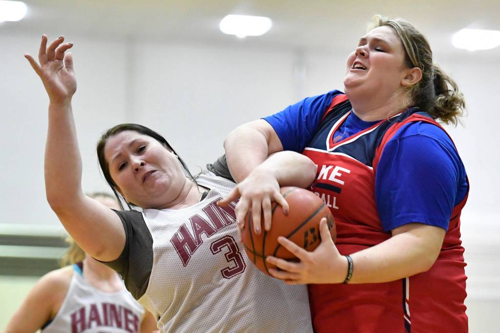 Kakes Hannah Ashenfelter, right, takes the ball from Haines Tiffany DeWitt at the Juneau Lions Club 73rd Annual Gold Medal Basketball Tournament at Juneau-Douglas High School: Yadaa.at Kalé on Wednesday, March 20, 2019. Haines won 67-20. (Michael Penn | Juneau Empire)