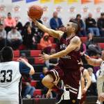 Hoonahs Marti Fred sails to the basket over Hoonah in the Masters bracket game at the Gold Medal Basketball Tournament on Thursday, March 21, 2019. (Michael Penn | Juneau Empire)