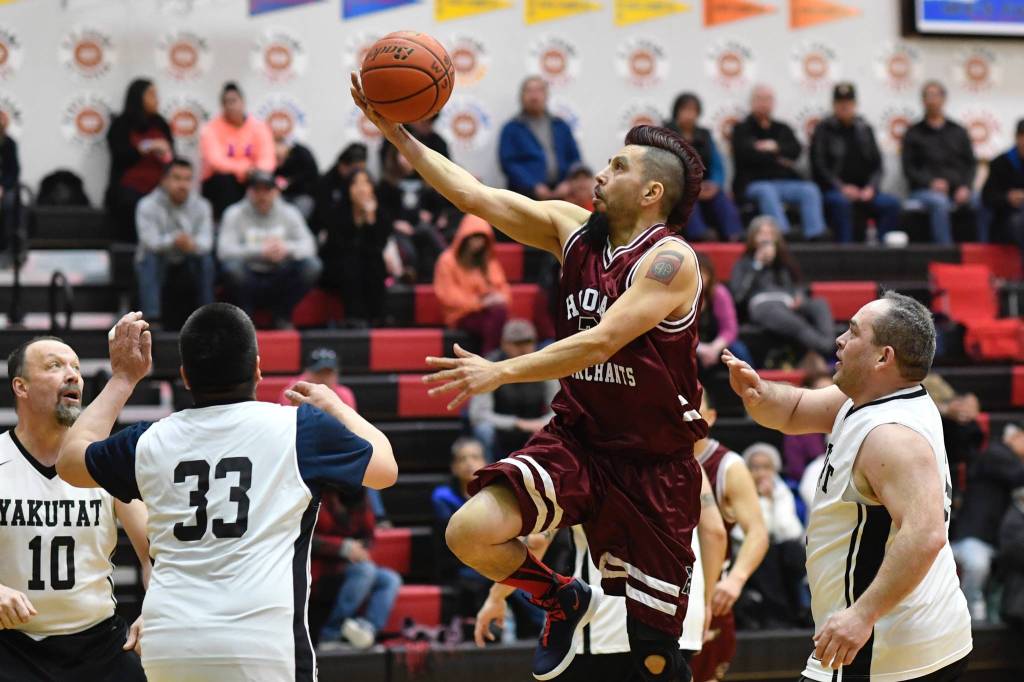 Hoonahs Marti Fred sails to the basket over Hoonah in the Masters bracket game at the Gold Medal Basketball Tournament on Thursday, March 21, 2019. (Michael Penn | Juneau Empire)