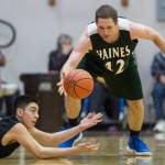Haines Kyle Fossman, right, and Hydaburgs Roger Trout chase a loose ball during their B bracket game at the Juneau Lions Club 73rd Annual Gold Medal Basketball Tournament at Juneau-Douglas High School: Yadaa.at Kalé on Thursday, March 21, 2019. Haines won 78-52. (Michael Penn | Juneau Empire)