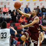 Hoonahs Marti Fred sails to the basket over Hoonah in the Masters bracket game at the Gold Medal Basketball Tournament on Thursday, March 21, 2019. (Michael Penn | Juneau Empire)