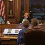 Reps. Sara Hannan, left, Dan Ortiz and Andi Story listen to Emily Ferry and her son Caleb Schane as they share their thoughts on the governors proposed budget to the House Finance Committee at the Alaska State Capitol on Friday, March 22, 2019. (Alex McCarthy | Juneau Empire)