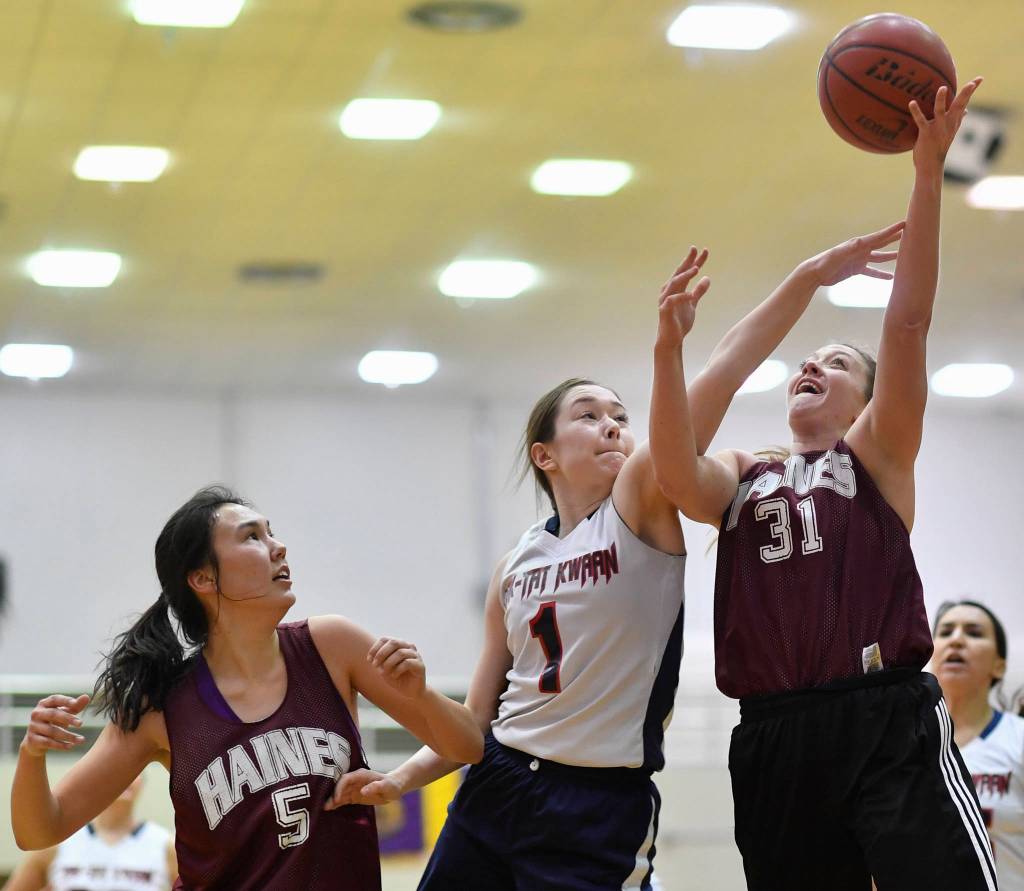 Haines Rachel Brittenham, right, shoots against Yakutats Shaye Jensen during their womens bracket game at the Juneau Lions Club 73rd Annual Gold Medal Basketball Tournament at Juneau-Douglas High School on Friday, March 22, 2019. Haines won 64-48. (Michael Penn | Juneau Empire)