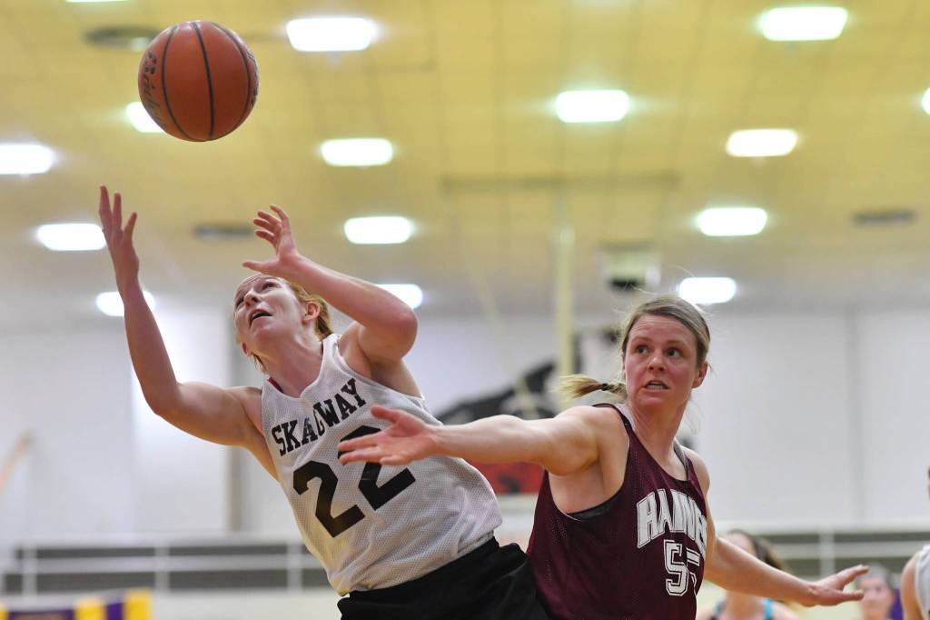 Skagways Jesse Ellis, left, beats Haines Alisa Beske to a rebound in the womens final at the Gold Medal Basketball Tournament on Saturday, March 23, 2019. (Michael Penn | Juneau Empire)
