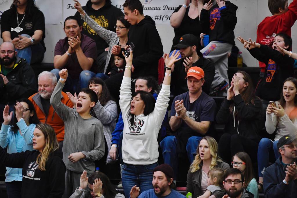 Skagway fans cheer on their womens team against Haines in the womens final at the Gold Medal Basketball Tournament on Saturday, March 23, 2019. (Michael Penn | Juneau Empire)