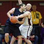 Hydaburgs Fred Hamilton, left, is guarded by Klukwans Brian Friske in the C bracket final at the Gold Medal Basketball Tournament on Saturday, March 23, 2019. (Michael Penn | Juneau Empire)