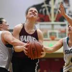 Haines Alisa Beske , center, is fouled by Skagways Tiffanie Ames, left, in the womens final at the Gold Medal Basketball Tournament on Saturday, March 23, 2019. (Michael Penn | Juneau Empire)