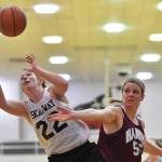 Skagways Jesse Ellis, left, beats Haines Alisa Beske to a rebound in the womens final at the Gold Medal Basketball Tournament on Saturday, March 23, 2019. (Michael Penn | Juneau Empire)