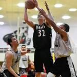 Haines Tyler Swinton, center, shoots between Angoons John Croasmun Jr., left, and Clayton Edwin in the B final at the Gold Medal Basketball Tournament on Saturday, March 23, 2019. Haines won 88-80. (Michael Penn | Juneau Empire)